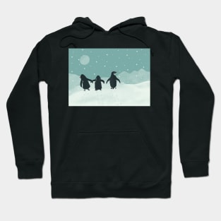 Penguin family walking in the moonlit snow Hoodie